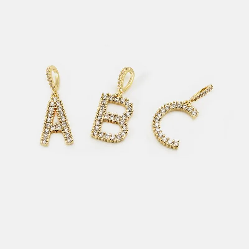 आरंभिक पेंडेंट सोना मढ़ा हुआ